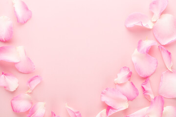 Fototapeta na wymiar Rose flowers petals on pastel background. Valentines day background. Flat lay, top view, copy space.