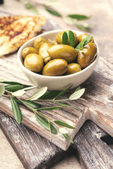 Green olives on gray background.