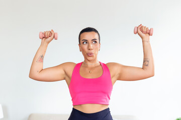 Biceps Exercises, Arms Workout. Confident Black Sportswoman Doing Training With Two Blue Dumbbells, Banner, Blurred Background. Portrait Of Smiling Strong Fit Lady In White Sportswear Bra Top