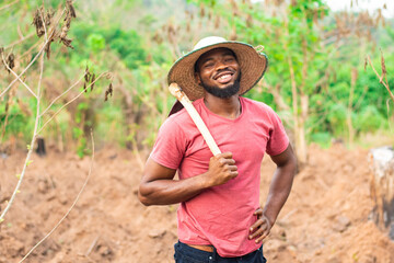 portrait of an african farmer smiling - obrazy, fototapety, plakaty