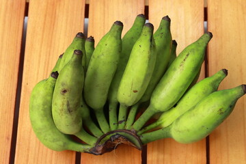 Bananas on wooden background. Fantastic bunch of banana collection. Ripe bunch of banana
