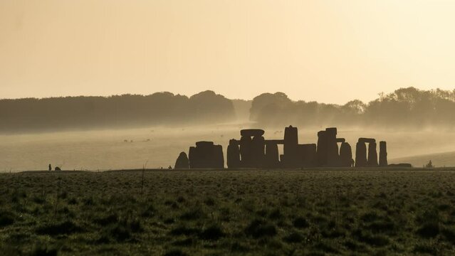 Time lapse with moody atmosphere at a sunny foggy morning at Stonehenge, England, United Kingdom