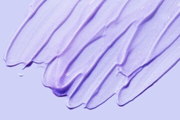 Liquid shimmering purple gel cosmetic smudge background