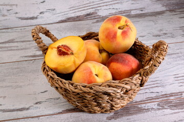 View of a bunch of peach fruits on wooden background.