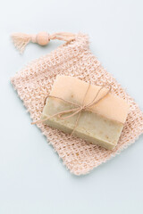Fototapeta na wymiar Handmade natural soap on pastel background.