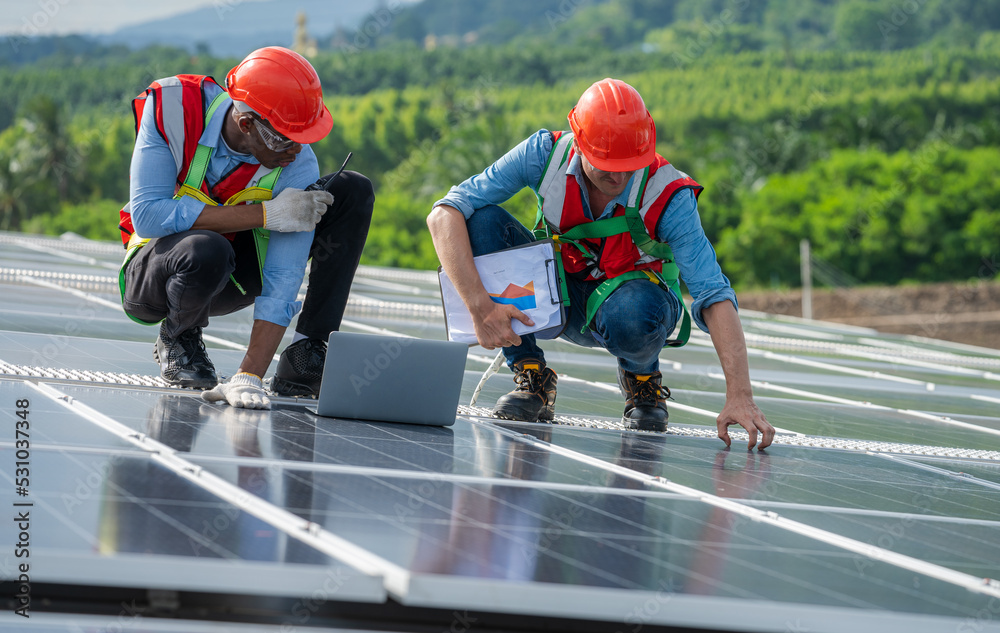 Poster Engineers checking the operation of the system solar cell on roof at factory,Alternative energy to conserve the world's energy,Photovoltaic module idea for clean energy production.