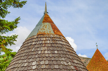 Conical roof with wooden tiles