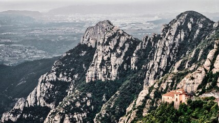 Naklejka premium Beautiful shot of a Holy Cave Of Montserrat surrounded by mountains
