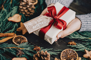 Christmas gift on the antique wooden background.