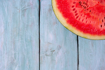 Fototapeta na wymiar Fresh water melon on turquoise wooden surface