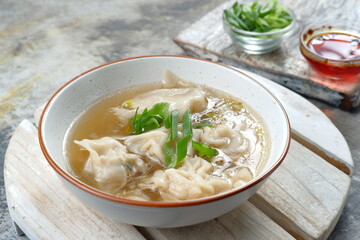 delicious of wonton soup with chili oil and green onion,chinese food,asian food style