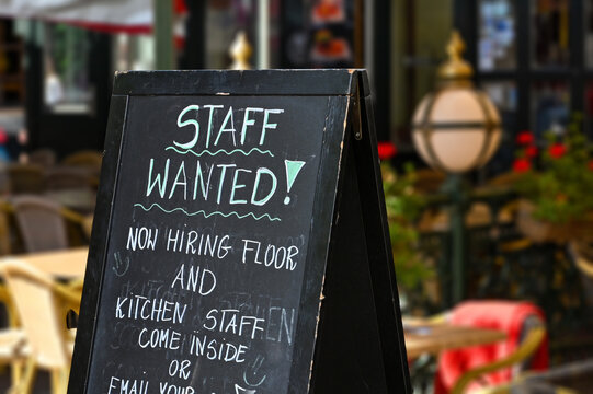 Staff wanted recruitment sign outside a restaurant in Europe