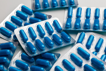 a lot of blue pills in blister packs