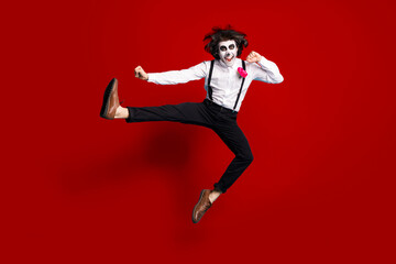 Fototapeta na wymiar Full length body size view of his he handsome funky cheerful cheery creepy energetic gentleman jumping dancing pirouette having fun calavera isolated bright vivid shine vibrant red color background