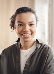 Portrait of a freelance woman smiling looking at the camera working in the office