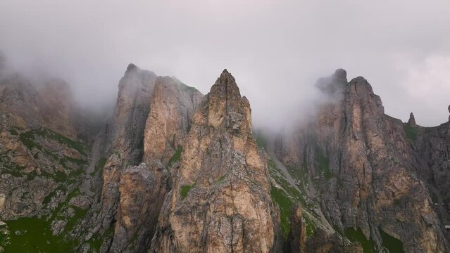 Aerial view of mystical rocks high in the mountains. Clouds on the rocks. natural video background