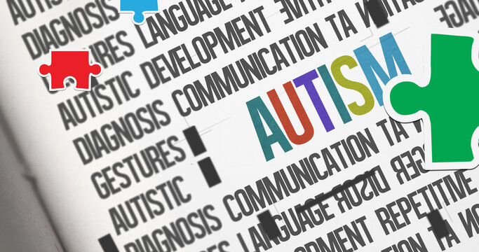 Image of red, green and blue autism awareness puzzles falling over autism text