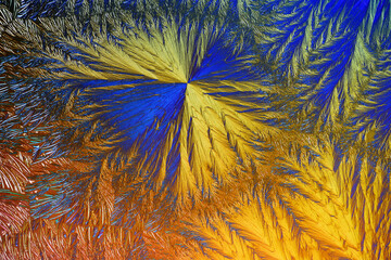 Colorful micro crystals in polarized light. Photo through a microscope. - 531047925