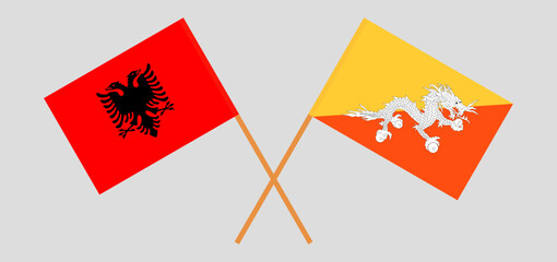 Crossed flags of Albania and Bhutan. Official colors. Correct proportion