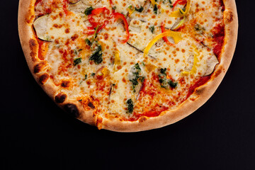 italian vegetarian pizza on black background