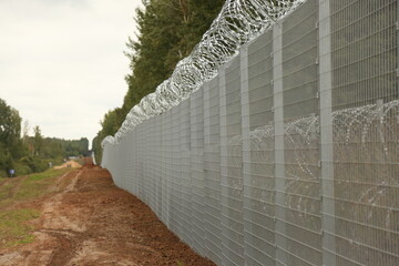 Barbed wire steel wall against the immigrations in Europe