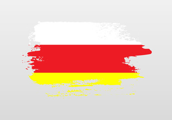 Modern style brush painted splash flag of North Ossetia with solid background