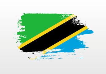 Modern style brush painted splash flag of Tanzania with solid background