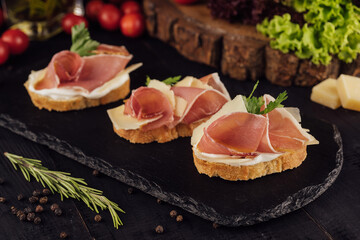 bruschetta set with parma ham and parmesan cheese