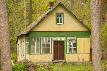 Old wooden house abandoned in the forest