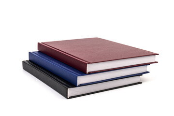 Stacked hardcover notebooks on white background. Education business concept.