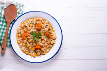 Chickpea stew with rice and carrots. Typical Spanish gastronomy dish.