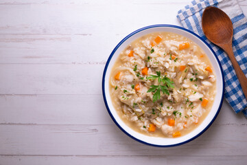 Soupy rice with artichokes and carrots. Typical Spanish gastronomy platter.