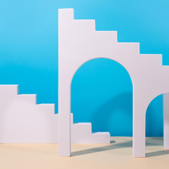 Blue and beige colored background and arched doors and arches - props for product photography. Mock up for presentation.