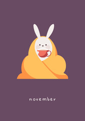 Card with rabbit. Cute bunny the bunny sits wrapped in a warm blanket and drinks. Month november