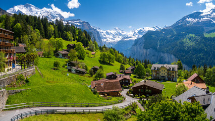 landscape of alpine village Wengen during spring sunny day in Switzerland - 531060121