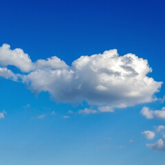white large cloud against the blue sky. Square image.