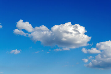 Naklejka na ściany i meble white large cloud against the blue sky