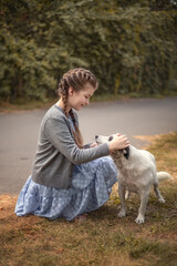 Photo of a girl with a pet dog.