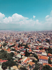 Aerial View Of Cityscape Against Sky with clouds