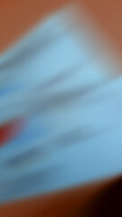 Abstract blurred background with brown on the edges and whitish blue in the middle.