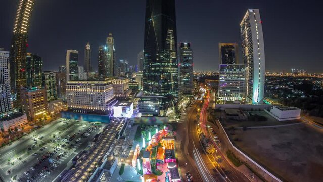 Panorama of Dubai International Financial district aerial day to night timelapse. View of business and financial office towers.