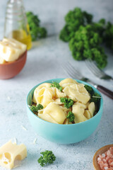 A bowl with Italian dumplings - tortellini