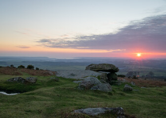 Sunset over Dartmoor with Tor in the foreground