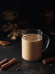 Fotobehang A cup with masala chai in low key © nastyakamysheva
