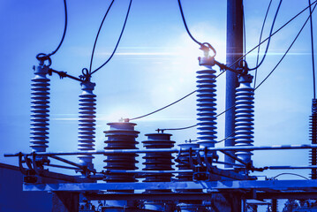 High voltage power transformer substation.High voltage electric power transformers in the blue...