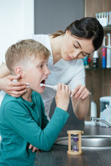 Young boy at the dentist learning dental hygiene