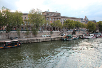 conti quay and river seine in paris (france)
