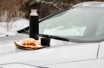 Outdoor picnic, on the hood of a car close-up