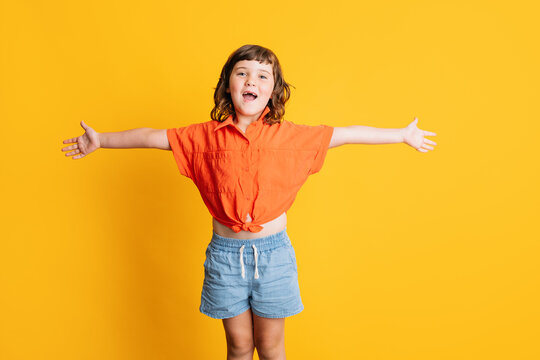 Cheerful girl with outstretched arms
