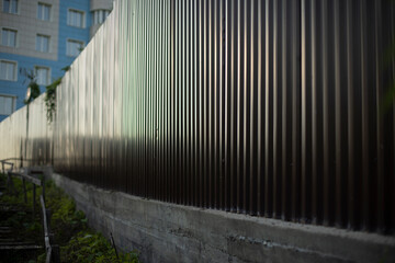 Fence made of steel. Steel fence profile. Private territory.